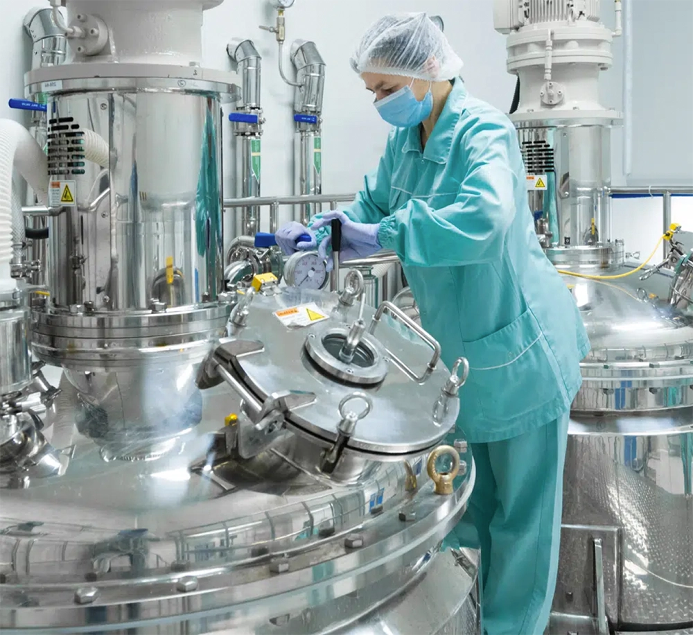 Technician working on industrial equipment